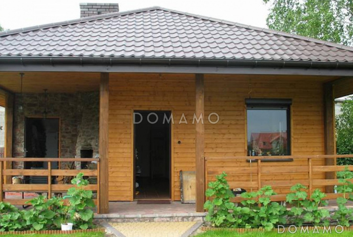 Проект компактного одноэтажного дома из газобетона с барбекю на большой террасе