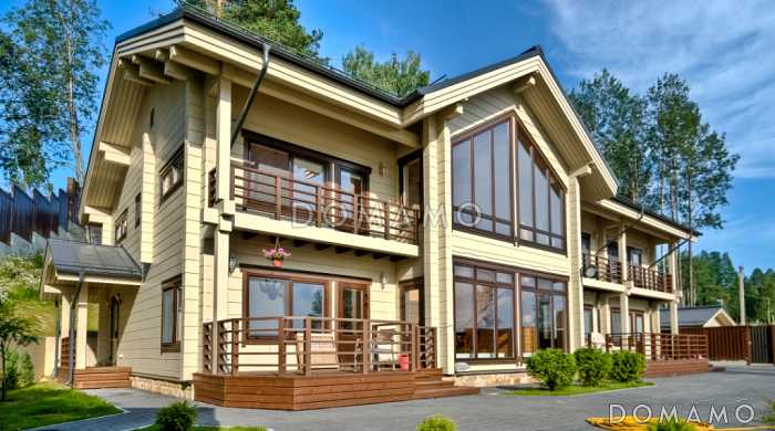 Проект двухэтажного дома из клееного бруса с шестью спальнями и гостиной на втором этаже