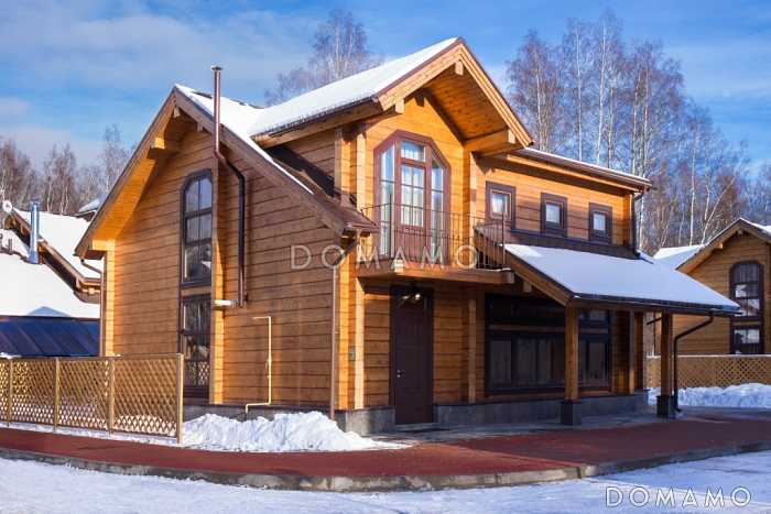 Проект двухэтажного дома из клееного бруса с изолированной кухней-столовой