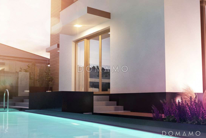 Проект современного комфортного двухэтажного дома из кирпича для двух семей с квартирами на разных этажах и общим гаражом с двумя въездами