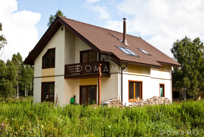 Проект кирпичного дома 9 на 10 с четырьмя спальнями