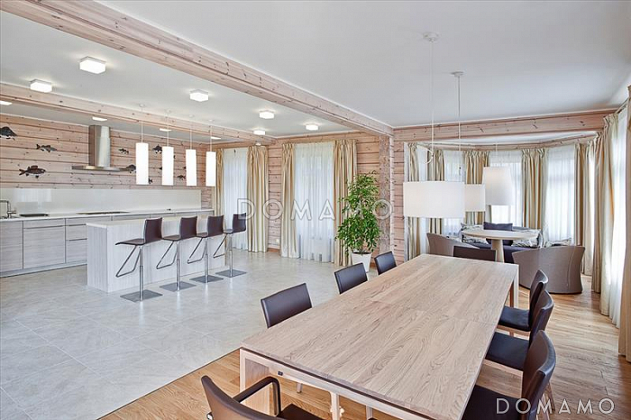 Проект стильного дома из клееного бруса с обширным остеклением и вторым светом