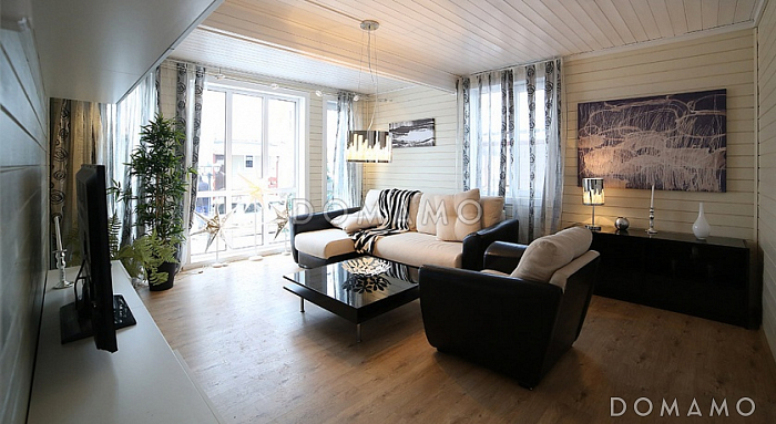 Проект яркого, каркасного дома с балконом на втором этаже