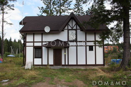 Проект дома из пеноблоков в стиле фахверк с сауной на мансардном этаже