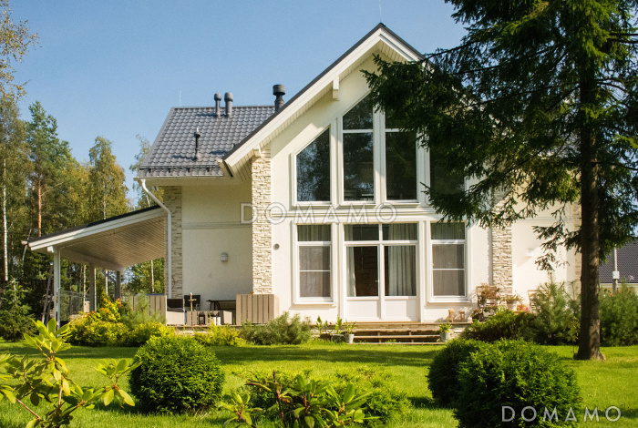 Проект дома из газобетона с навесом для машины