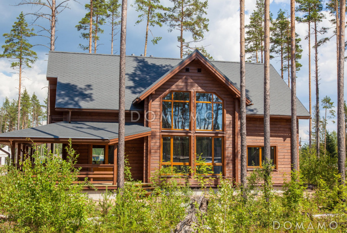 Проект каркасного дома с огромной крытой террасой