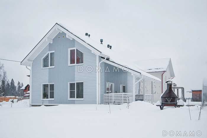 Проект кирпичного коттеджа в скандинавском стиле с 4 спальнями, светлой гостиной и террасой